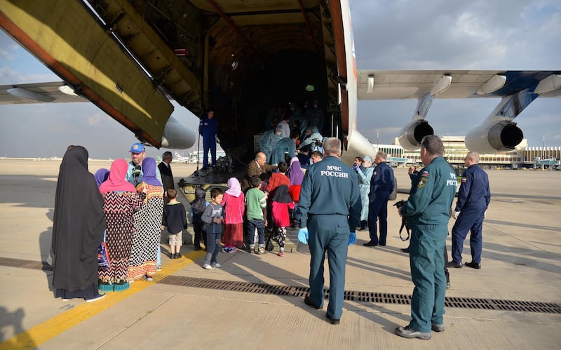 epa07254309 Children of suspected Islamic State fighters (IS) board a Russian plane at the runway of Baghdad International Airport in Baghdad, Iraq, 30 December 2018. Iraq has repatriated 30 children of suspected Islamic State fighters most of them from former Soviet states, such as Tajikistan, Chechnya and Russia. The handover was attended Russian President's commissioner Anna Kuznetzova and Russian ambassador to Iraq Maksim Maksimov. A security source said that 'the children were found in Mosul after the Iraqi security forces have defeated the (IS) in the city last year, adding that the fathers of the children had been killed during the fighting or were arrested'.  EPA/MURTAJA LATEEF