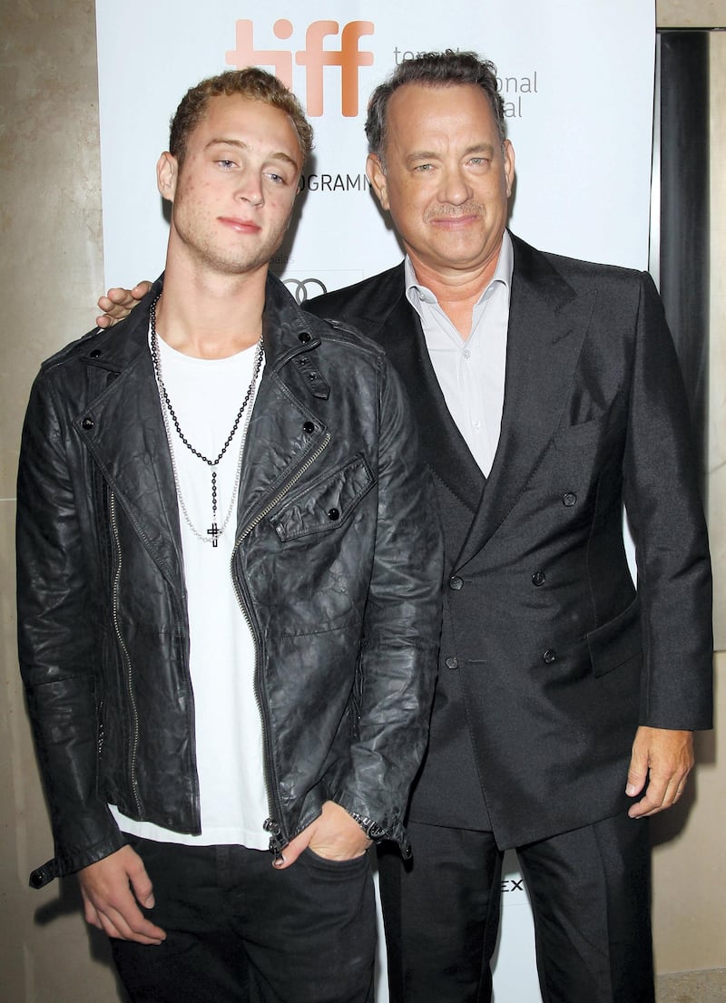 TORONTO, ON - SEPTEMBER 08:  Tom Hanks (R) and his son Chet Hanks arrive at "Cloud Atlas" premiere during the 2012 Toronto International Film Festival held at Princess of Wales Theatre on September 8, 2012 in Toronto, Canada.  (Photo by Michael Tran/FilmMagic)