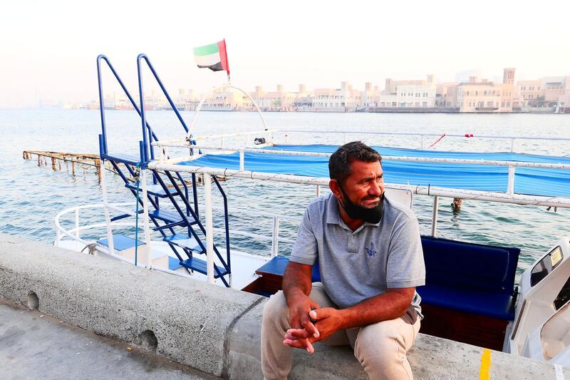 Mohammed Akram waiting for the customers near his boat at the creek in Deira Dubai during the evening on April 21, 2021. Pawan Singh / The National. Story by Sarwat Nasir