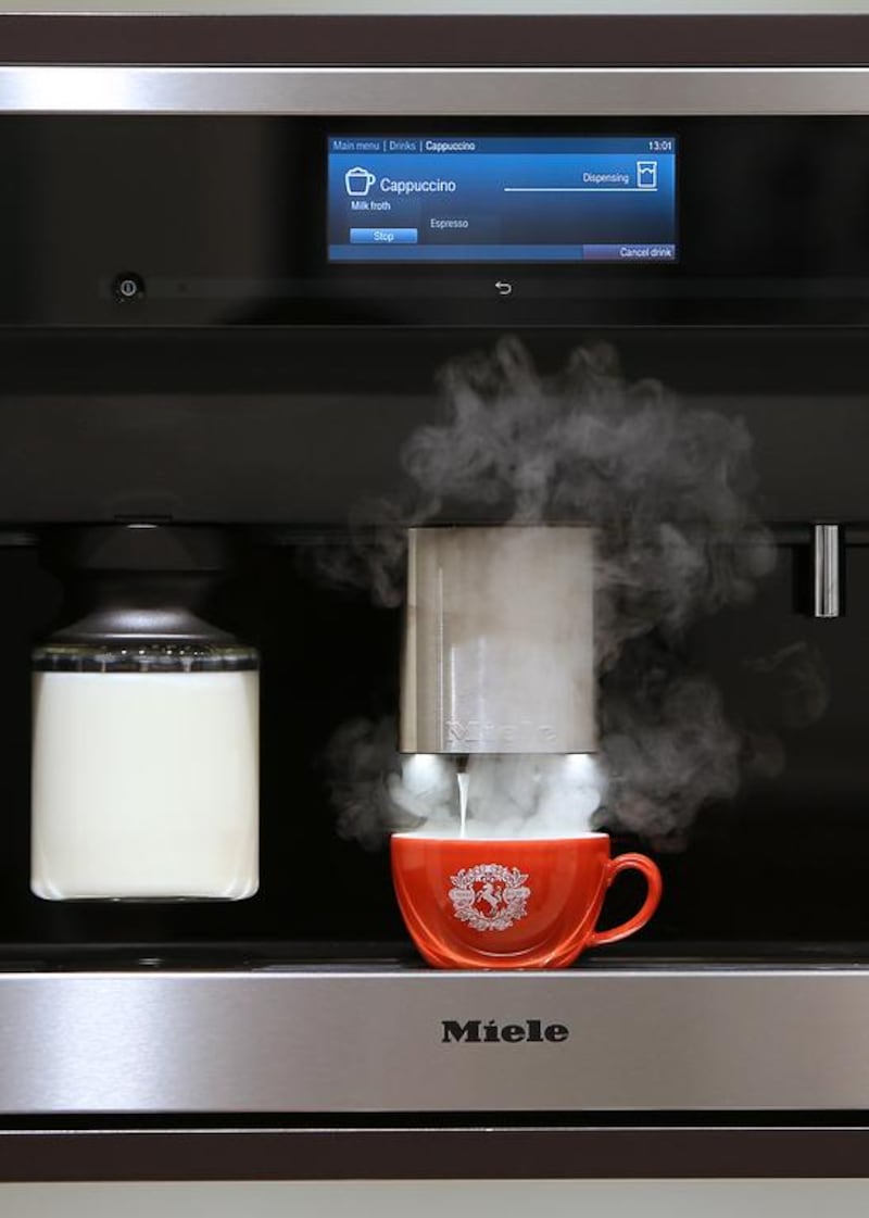A Miele coffee machine prepares a cup of espresso. Pawan Singh / The National