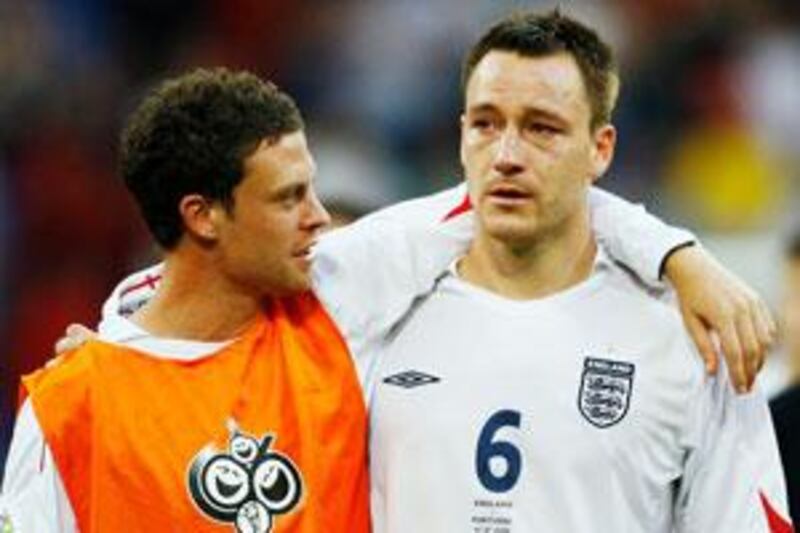 Wayne Bridge, left, consoles John Terry, his then Chelsea teammate, following defeat to Portugal at the 2006 World Cup.