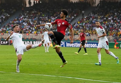 Egypt's Ahmed Fatouh, middle, defends against Morocco's Munir El Haddadi, left, in Yaounde, Cameroon. AP