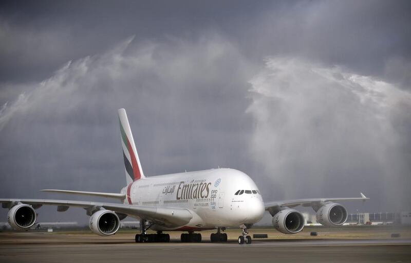 An Emirates Airbus A380 is showered by water canons on airport emergency vehicles as it makes it's inaugural arrival at Dallas-Fort Worth International Airport last year. Tony Gutierrez / AP Photo