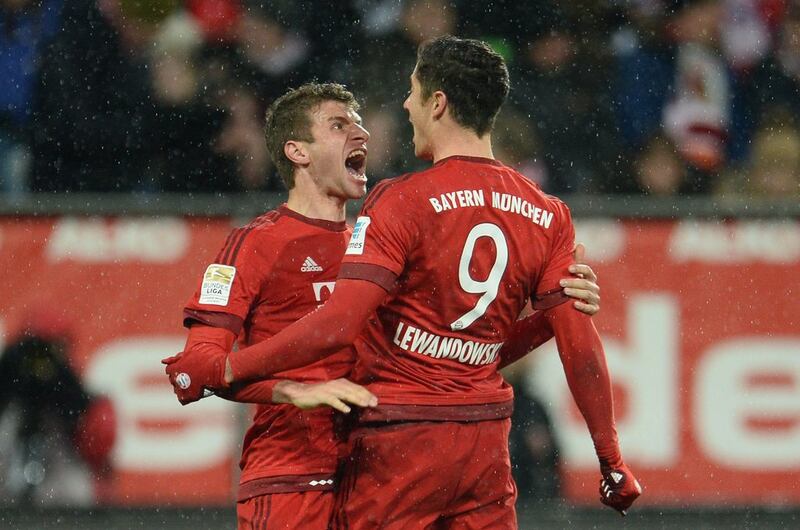 Thomas Muller and Robert Lewandowski of Bayern Munich celebrate a goal against Augsburg in the Bundesliga in 2016. EPA  