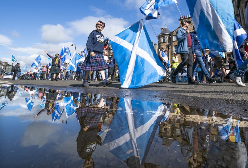 Supporters of Scottish independence march to the site of the Battle of Bannockburn for an 'All Under One Banner' rally . A poll commissioned by 'The National' suggests fewer than a third of Brits think Scotland will remain part of the UK by 2050. PA