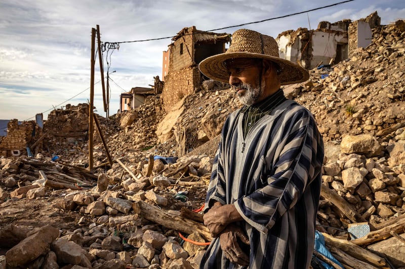 A man surveys destroyed buildings in the earthquake-hit village of Douzrou, Morocco. AFP