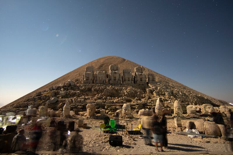 A 50-metre-high man-made mound — the presumed tomb of Antiochus — sets the background.