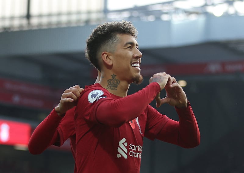 Liverpool's Roberto Firmino celebrates scoring the first goal. Reuters