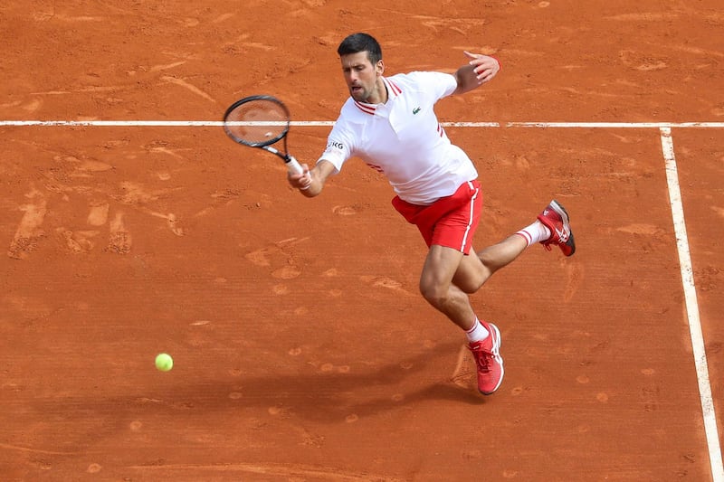 Serbia's Novak Djokovic plays a return during his defeat against Dan Evans. AFP