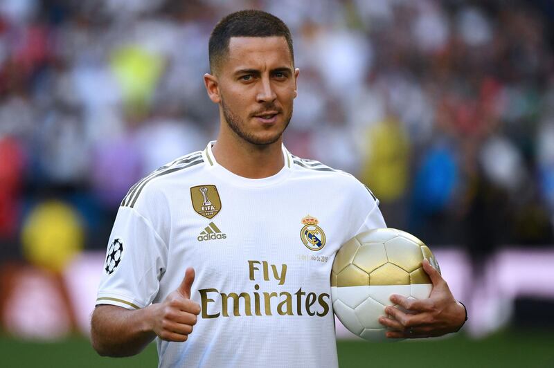 Eden Hazard poses for photos inside the Santiago Bernabeu. AFP