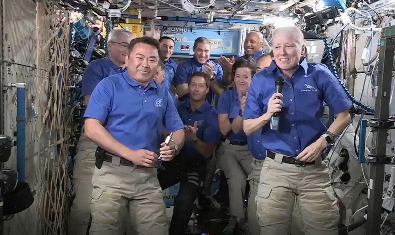 This Nasa TV frame grab image shows astronaut Shannon Walker of Nasa handing over International Space Station command to Japan Aerospace Exploration Agency's Akihiko Hoshide, as the the rest of the crew look on. AFP