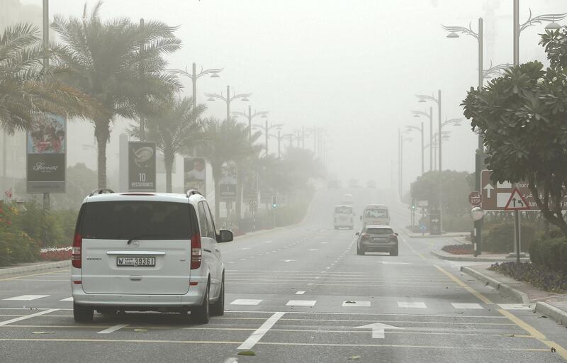 DUBAI , UNITED ARAB EMIRATES , February 03 – 2019 :- Traffic during the dusty and windy weather on Palm Jumeirah in Dubai. ( Pawan Singh / The National ) For News. 
