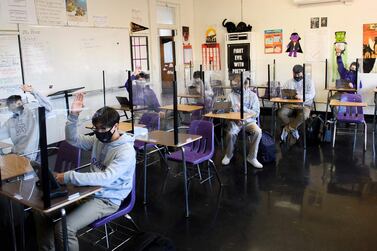 Students attend an in-person English class at St Anthony Catholic High School during the pandemic in Long Beach, California. AFP