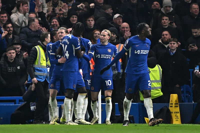 Mykhaylo Mudryk celebrates with teammates after scoring Chelsea's third goal. Getty Images