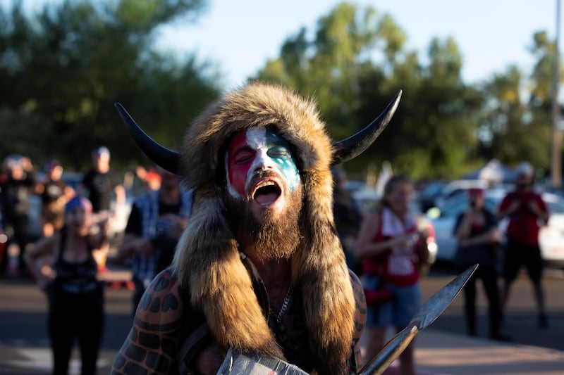 A person reacts to Black Lives Matter protesters who arrived at a rally against restrictions to prevent the spread of coronavirus, in Phoenix, Arizona, US. Reuters