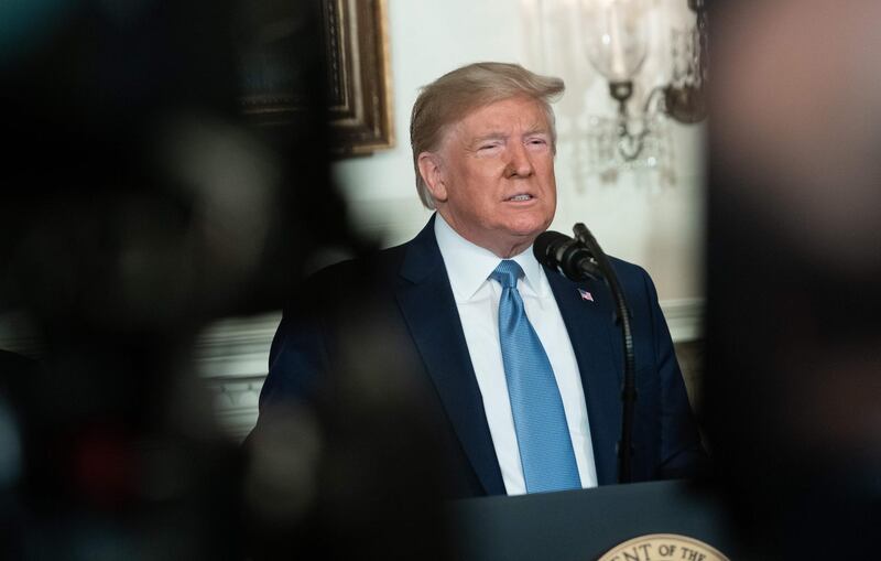 US President Donald Trump speaks about the mass shootings from the Diplomatic Reception Room of the White House in Washington, DC, August 5, 2019. US President Donald Trump described mass shootings in Texas and Ohio as a "crime against all of humanity" as he addressed the nation on Monday after the attacks that left in 29 people dead. "These barbaric slaughters are... an attack upon a nation, and a crime against all of humanity," he said.
 / AFP / SAUL LOEB
