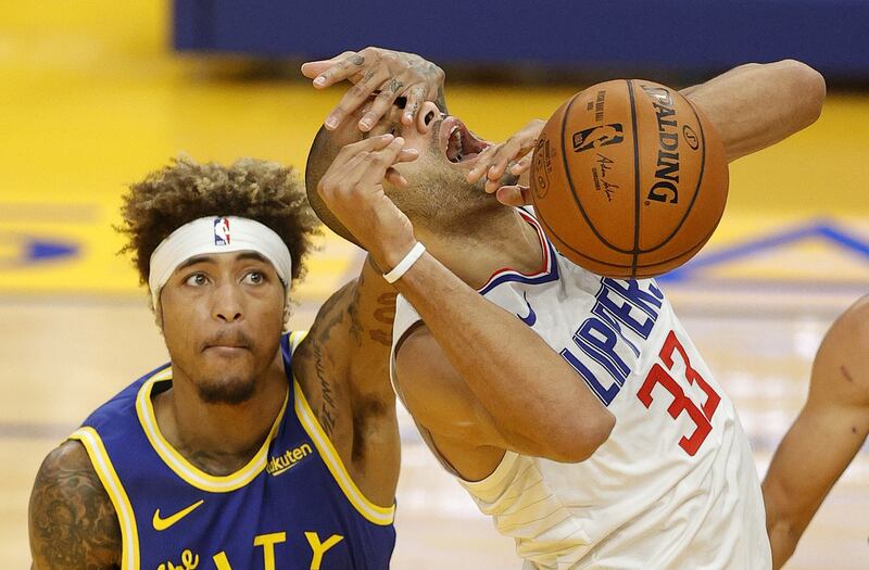 Nicolas Batum of the LA Clippers is fouled by Golden State Warriors' Kelly Oubre Jr. during the NBA game at Chase Centre in California, on Wednesday January 6. Clippers won the game 108-101. AFP