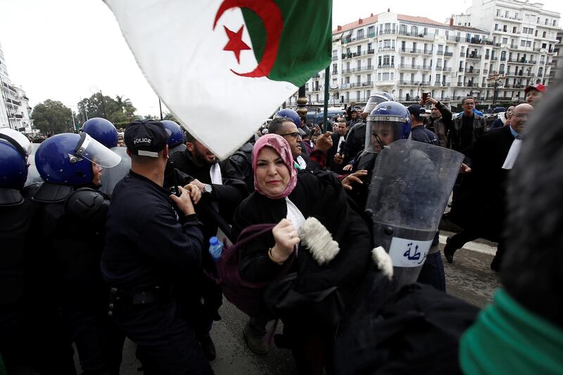 Police try to disperse lawyers marching during a protest to demand the immediate resignation of President Abdelaziz Bouteflika, in Algiers, Algeria. Reuters