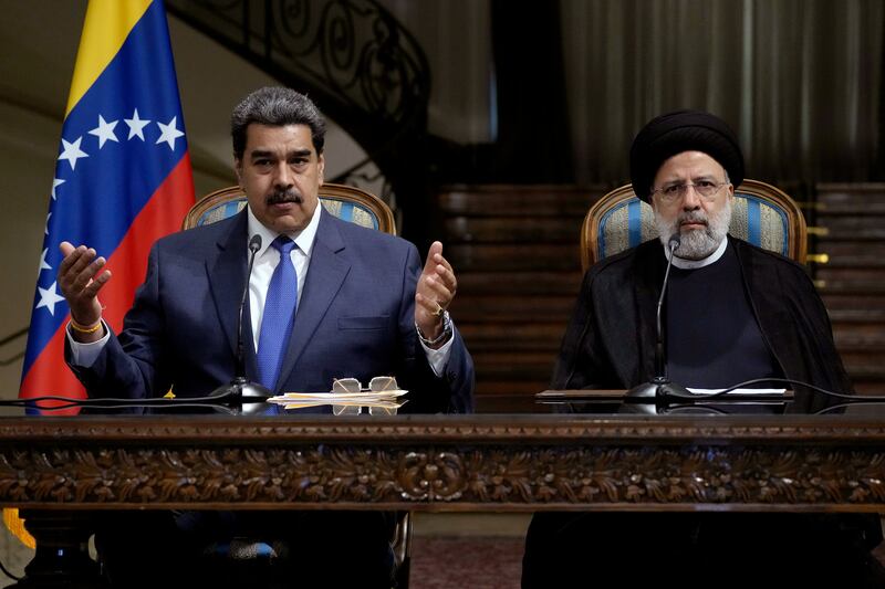 Venezuela's President Nicolas Maduro, left, with Iranian President Ebrahim Raisi at the Saadabad Palace in Tehran, Iran. AP
