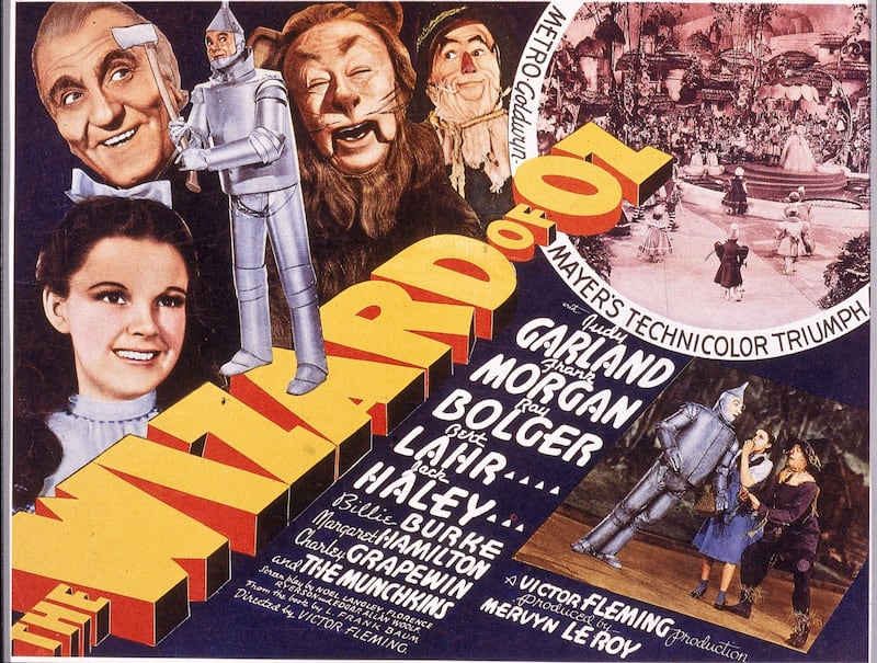 A lobby card from the film 'The Wizard Of Oz,' shows an illustration of American actress Judy Garland (1922 - 1969) (as Dorothy) and, left to right, actors Frank Morgan (1890 - 1949) (as the Wizard), Jack Haley (1898 - 1979) (as the Tin Man), Bert Lahr (1895 - 1967) (as the Cowardly Lion), and Ray Bolger (1904 - 1987) (as the Scarecrow), 1939. Several scenes from the film, which was directed by Victor Fleming, are also visible. (Photo by Hulton Archive/Getty Images)