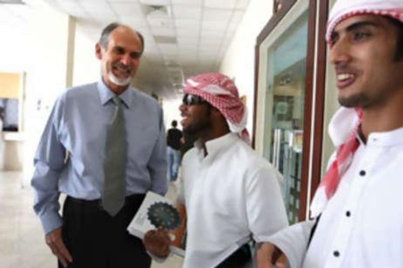 Rory Hume, the new provost at the United Arab Emirates University in Al Ain, talks to students Azzan al Falsei and Mohammed Saif.