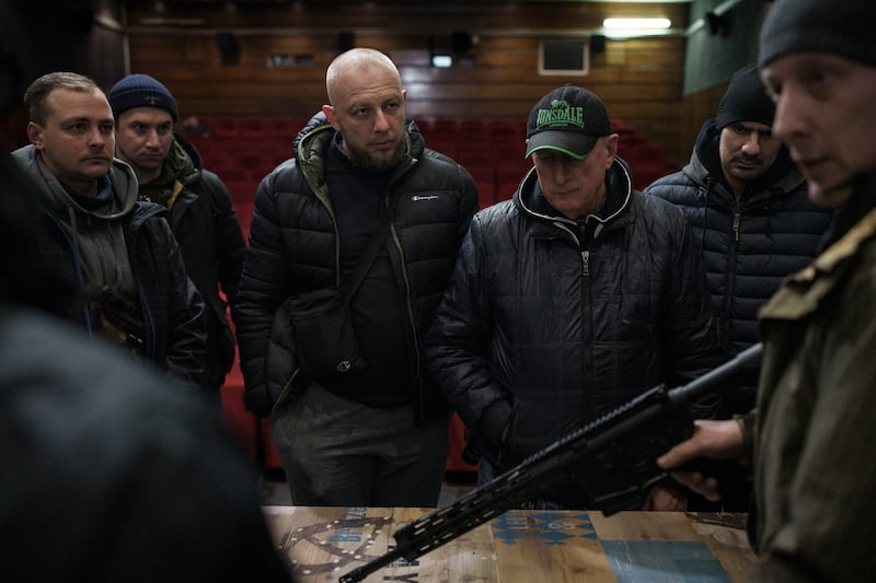Ukrainian civilians receive weapons training in a cinema in Lviv, western Ukraine. AP Photo