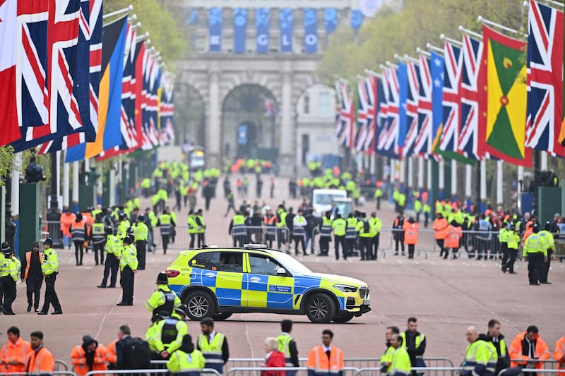Metropolitan Police officers and security staff gather on The Mall. Getty