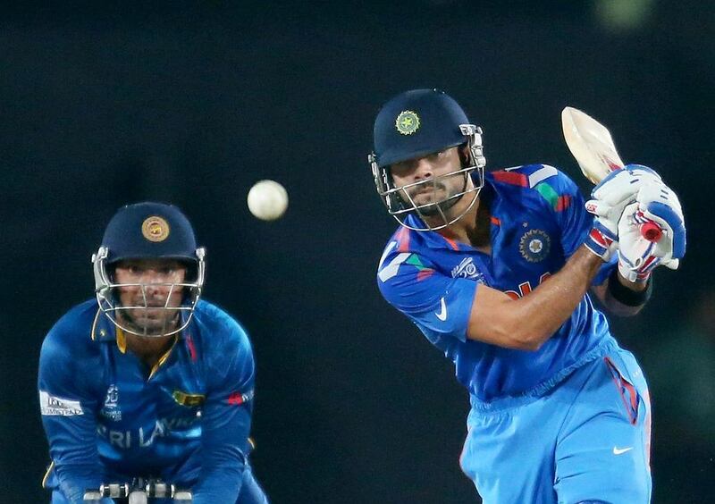 Virat Kohli bats as Kumar Sangakkara keeps wickets during the final of the 2014 ICC World Twenty20 between India and Sri Lanka in Dhaka. Getty Images