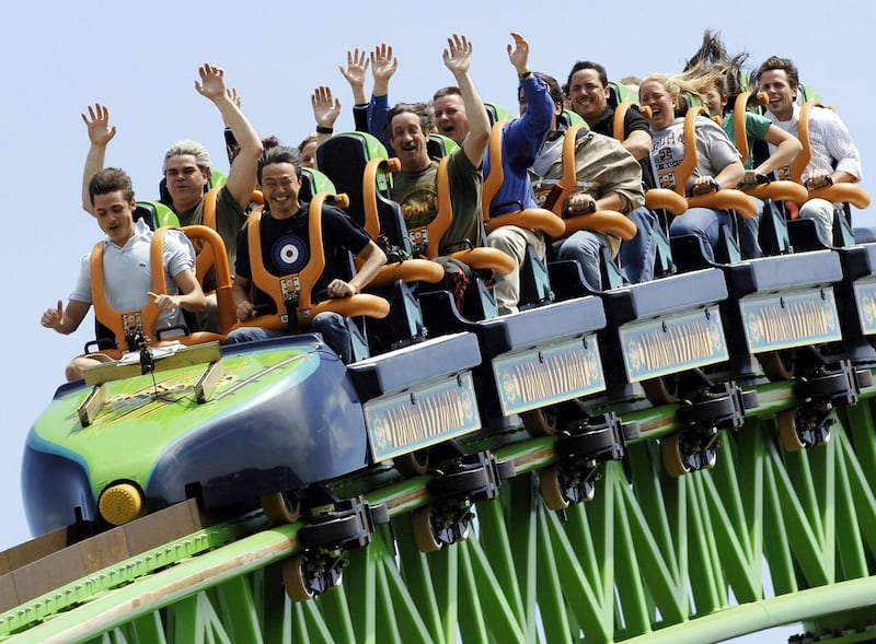 Riders raise their arms as they travel the Kingda Ka rollercoaster at Six Flags amusement park in Jackson, New Jersey. Stan Honda / AFP