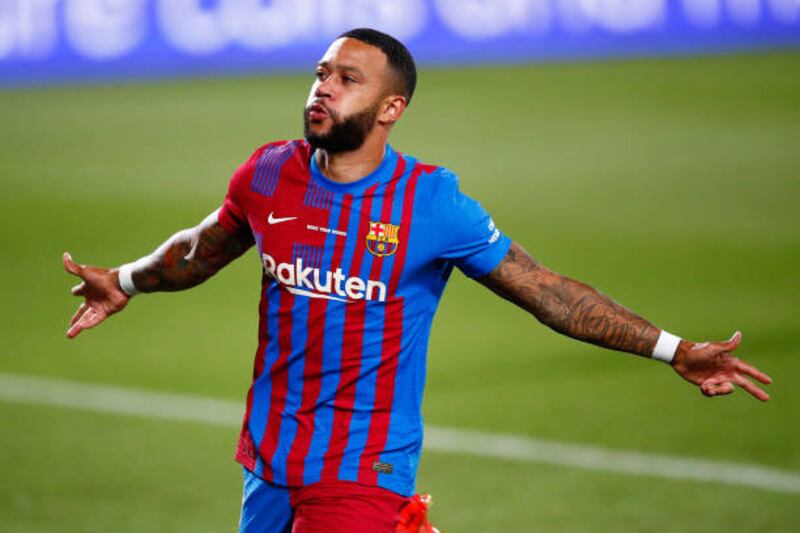 Barca's Memphis Depay celebrates scoring his side's first goal during the Joan Gamper Trophy match against Barcelona.