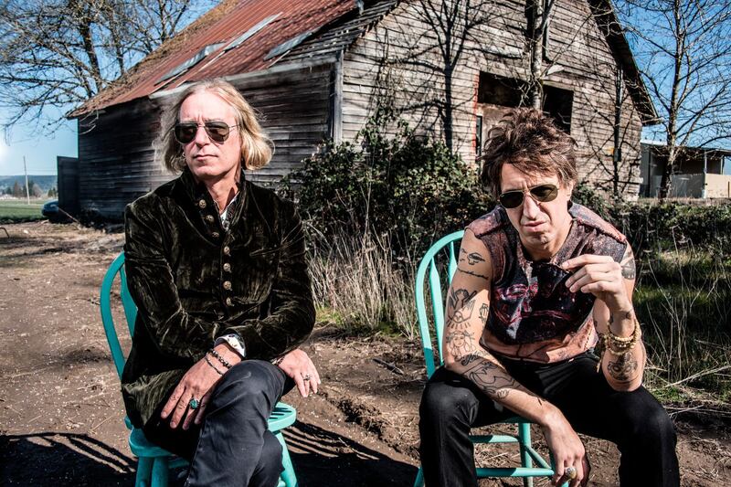 This undated mage released by New West Records shows Peter Buck, left, and Joseph Arthur who released a collaboration album "Arthur Buck." (Dean Karr/New West Records via AP)