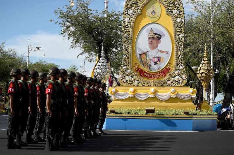 Soldiers gather in front of a portrait of Thailand's King, ahead of the coronation.  AFP