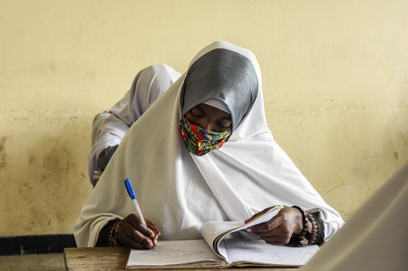 Students of Al-Haramain secondary school attend a class on their first day of re-opened school in Dar es Salaam, Tanzania.  AFP