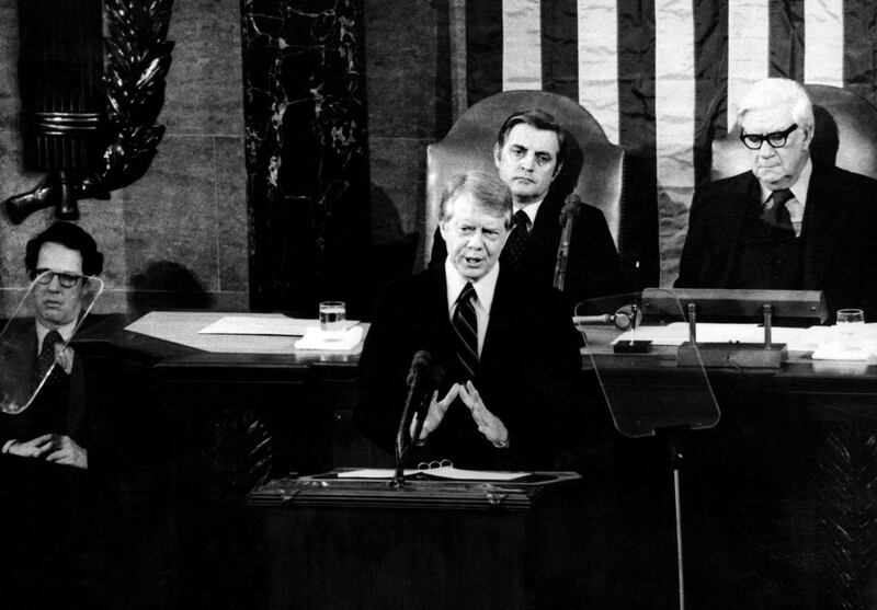 Former US president Jimmy Carter gives a speech as then-vice president Mondale looks on. AFP