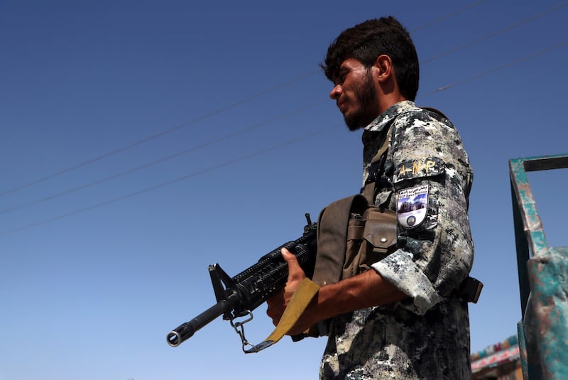 A policeman stands guard on the outskirts of Mazar-i-Sharif, before the Taliban assault.