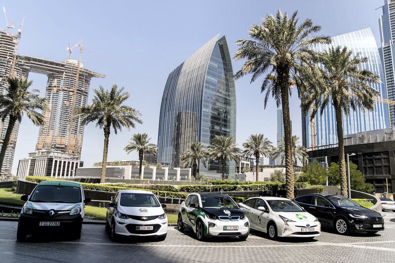 DUBAI, UNITED ARAB EMIRATES - SEP 24:

Hybrid and electric cars, parked outside Armani Hotel, where, today, a press aconference was held announcing incentives to promote electric vehicles in Dubai.

(Photo by Reem Mohammed/The National)

Reporter: LeAnne Graves
Section: NA