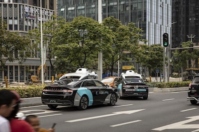 Pony.ai Inc. autonomous vehicles travel along a road in the Nansha district of Guangzhou, Guangdong Province, China, on Wednesday, April 10, 2019. Domestic and foreign testers are putting cars, buses, trucks and delivery vans through self-driving trials to teach them how to navigate the notoriously congested streets of the world's biggest auto market. Photographer: Qilai Shen/Bloomberg