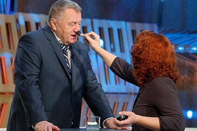 Vladimir Zhirinovsky, leader of the Liberal Democratic Party of Russia (LDPR) has makeup applied before a television pre-election debate on Russia's Channel One in Moscow November 23, 2011. Russians will vote in parliamentary elections on December 4.  REUTERS/Anton Golubev  (RUSSIA - Tags: POLITICS ELECTIONS)