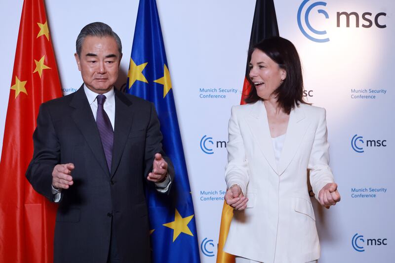 China's Foreign Minister Wang Yi and his German counterpart Annalena Baerbock arrive for a bilateral meeting. Getty Images