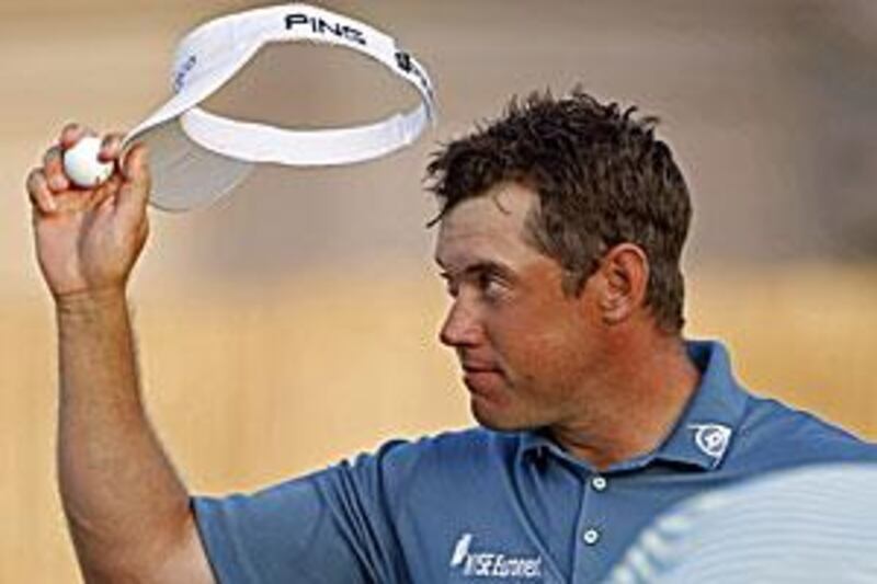 Westwood acknowledges the 18th hole gallery after winning the Dubai World Championship.