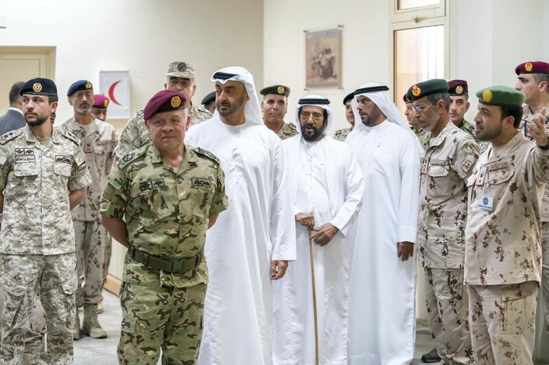 AL DHAFRA REGION, ABU DHABI, UNITED ARAB EMIRATES - June 26, 2019: HH Sheikh Mohamed bin Zayed Al Nahyan, Crown Prince of Abu Dhabi and Deputy Supreme Commander of the UAE Armed Forces (3rd L) and HM King Abdullah II, King of Jordan (2nd L), attend the UAE and Jordan joint military drill, Titled ‘Bonds of Strength’, at Al Hamra Camp. Seen with HE Lt General Hamad Thani Al Romaithi, Chief of Staff UAE Armed Forces (2nd R), HH Sheikh Tahnoon bin Mohamed Al Nahyan, Ruler's Representative in Al Ain Region (4th R), HRH Hussein bin Abdullah, Crown Prince of Jordan (L) and Rear Admiral Pilot HH Sheikh Saeed bin Hamdan bin Mohamed Al Nahyan, Commander of the UAE Naval Forces (back L).

( Hamad Al Mansouri for Ministry of Presidential Affairs )
---