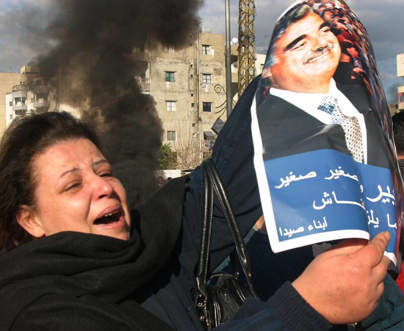 A Lebanese woman mourns former prime minister Rafik al-Hariri during an anger protests in the port city of Sidon.  A Lebanese woman mourns the killing of former prime minister Rafik al-Hariri during angry protests in the port-city of Sidon February 15, 2005. Lebanon shut down on Tuesday to mourn former Prime Minister Rafik al-Hariri whose assassination in a car bomb blast plunged the country into political crisis and rekindled bitter memories of the 1975-1990 civil war. REUTERS/Ali Hashisho