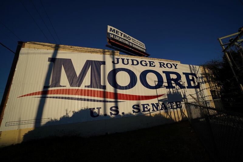 A banner promoting Republican Senatorial candidate Roy Moore is pictured on the side of a building in Birmingham, Alabama, U.S., December 10, 2017.  REUTERS/Carlo Allegri