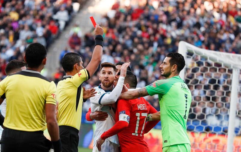 Messi looks on in shock after being sent off. AP Photo