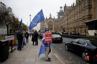 Anti-Brexit supporter Steve Bray from south Wales, protests outside the Houses of Parliament in London, Thursday Nov. 15, 2018. A pro-Brexit group of Conservative lawmakers says one of its leaders, Jacob Rees-Mogg, is formally calling for a vote of no-confidence in Prime Minister Theresa May. Two British Cabinet ministers, including Brexit Secretary Dominic Raab, resigned Thursday in opposition to the divorce deal struck by Prime Minister Theresa May with the EU â€” a major blow to her authority and her ability to get the deal through Parliament. (AP Photo/Matt Dunham)