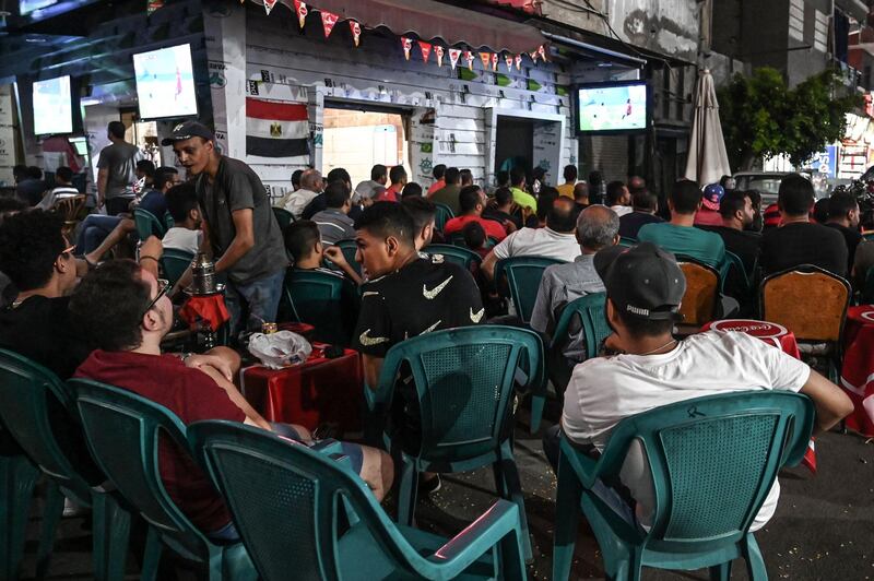 Egyptians gather at a cafe in the city of Ismailia to watch the 2019 Africa Cup of Nations Group A football match between Uganda and Egypt.  AFP