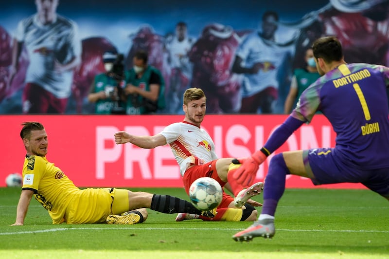 Dortmund goalkeeper Roman Buerki saves from Leipzig's Timo Werner. AP