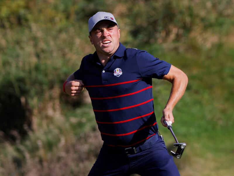 Team USA's Justin Thomas reacts after holing his putt on the 9th green. Reuters