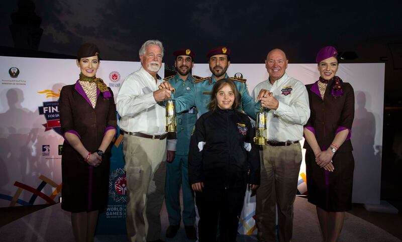 Special Olympics Ambassador Chaica Al Qassimi with the Guardians of the Flame and the World Games Flame of Hope. Courtesy Etihad