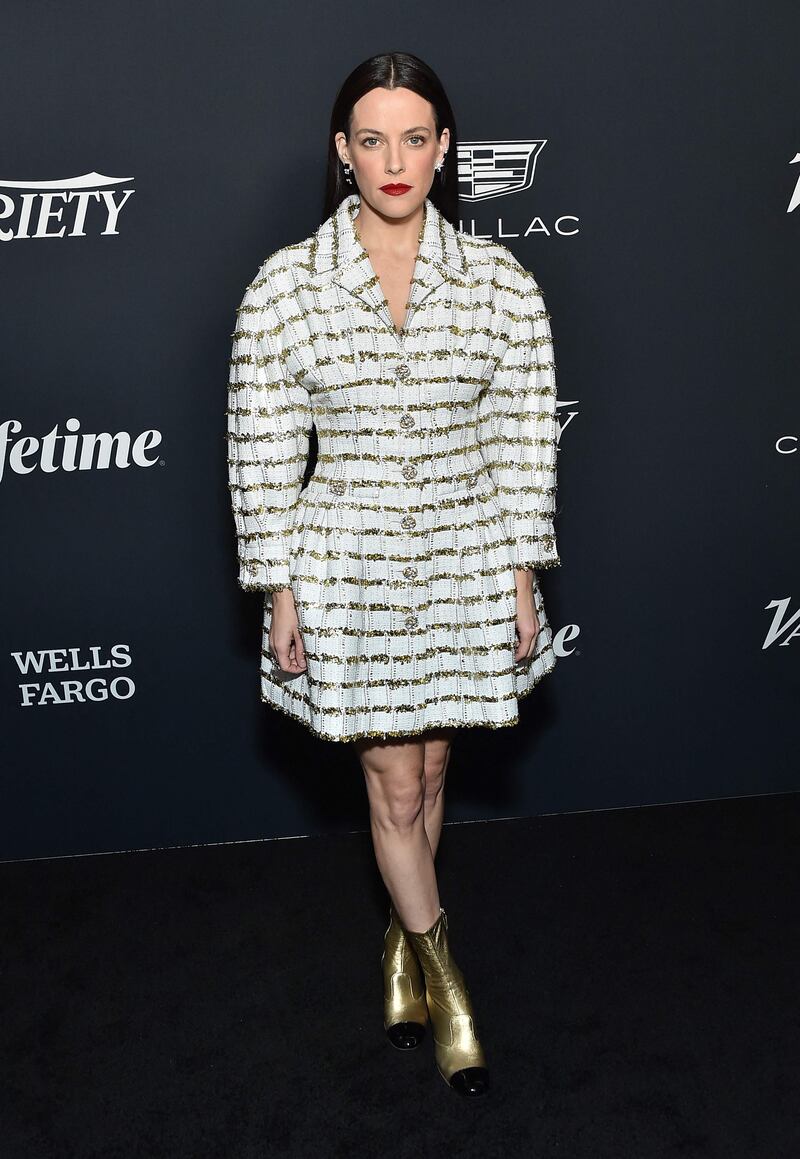 Actress Riley Keough, daughter of the late Lisa Marie Presley, wore a Chanel tweed dress, with golden ankle boots. AFP 